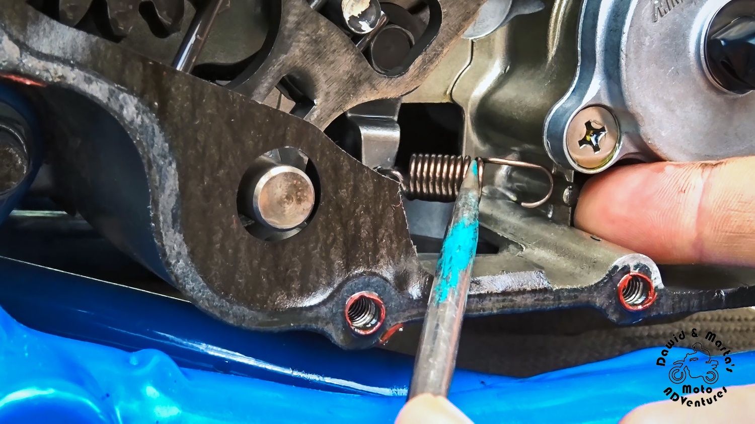 Removing clutch detent arm tensioning spring