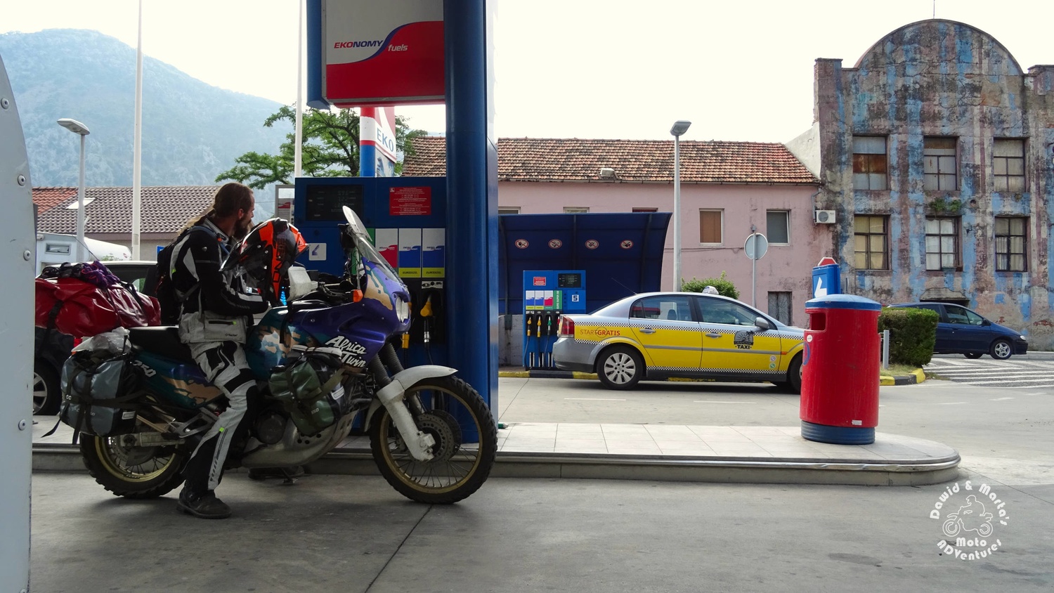 Tanking the motorbike at gas station in Skaljari