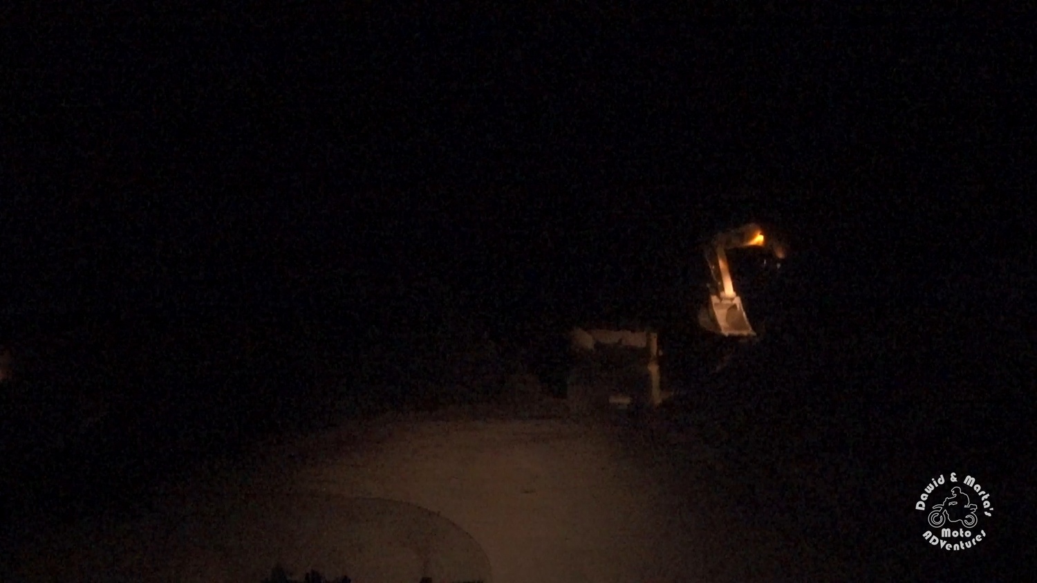 Digger working at night at road to Lovcen National Park